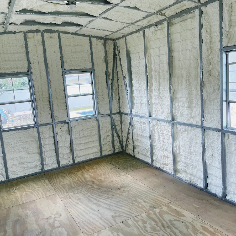 Closed-cell spray foam insulation applied to wall cavities in a residential project in Lawrence